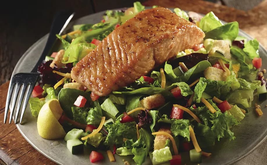 Farm-Fresh Field Greens with Grilled Salmon* - Entrée Salads Farm-Fresh Field Greens with Grilled Salmon* - Entrée Salads on LongHorn Steakhouse menu